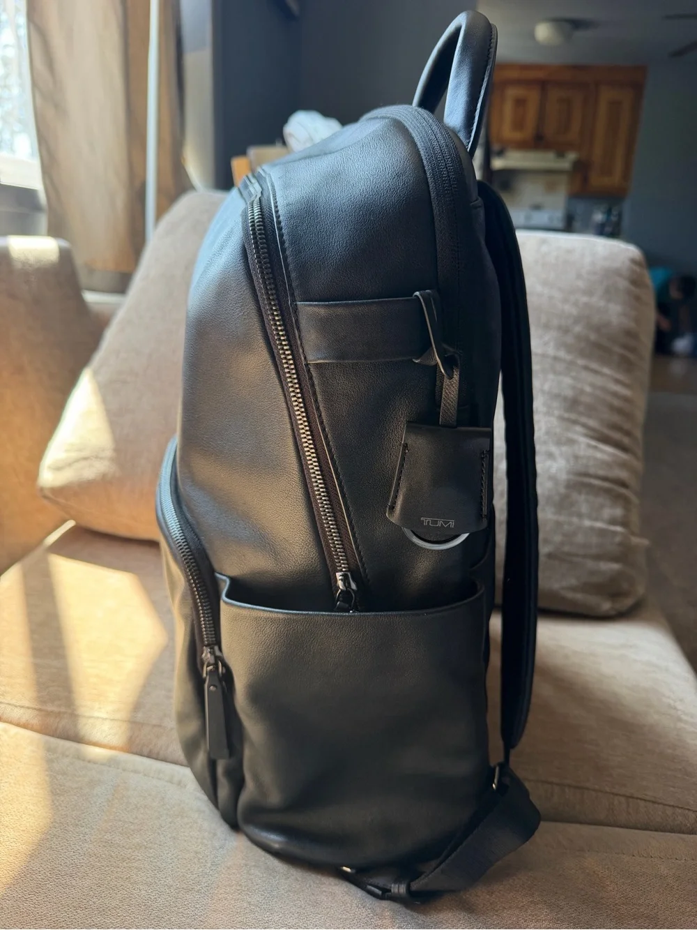 Tumi Black Leather Men's Backpack with Front Zip Pocket